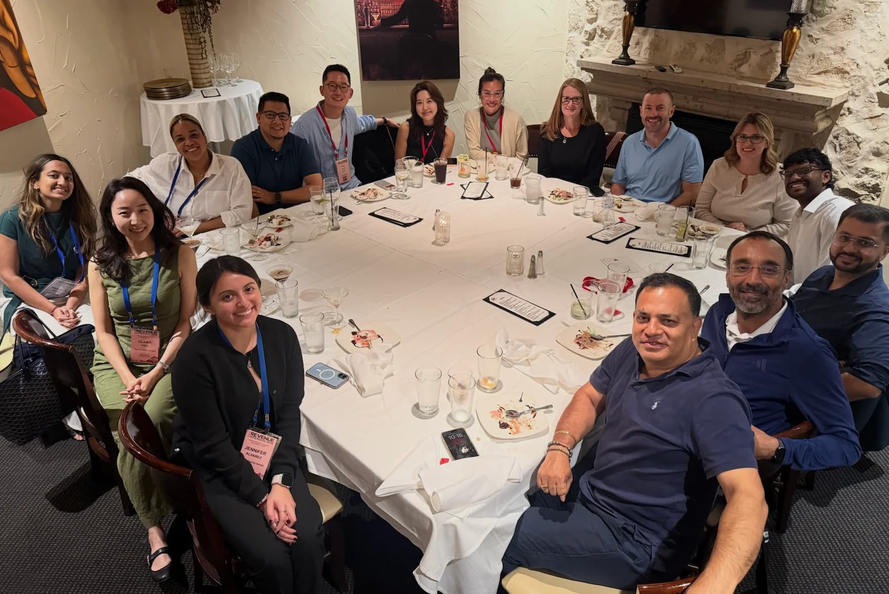 Dental professionals and the Kairos team around a conference dinner table